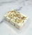 Unwrapped Positive Energy soy wax melt bar, six cubes topped with Citrine, Peridot and Sunstone chips, lavender buds, rosemary and eucalyptus on marble