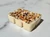 Winter Spice Wax Melts unpackaged six-cube soy wax bar topped with crystal chips and dried herbs on white marble