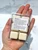 Back of Winter Spice Wax Melts clamshell in hand showing the six soy wax cubes and instruction label