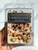 Winter Spice Wax Melts by New Moon Beginnings in a clear clamshell, cream soy wax topped with Garnet, Carnelian, Sunstone and Citrine chips with dried orange, chamomile and clove