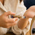 Person applying Evil Eye Protection Oil roller to their wrist