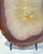 Close-up of the golden-cream quartz center with fine radiating crystal fibers