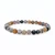 Dendritic Agate elastic bracelet with 6mm beads on a plain white background