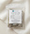 Cleansing Bundle Trio in its resealable bag with product label on white linen