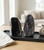 Two Black Amethyst geodes with polished edges displayed on a dark tray in a bright living room