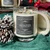 Winter crystal candle styled with a frosted pine cone, green cloth and red berries for a holiday display