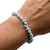 Larimar chip elastic bracelet worn on a wrist
