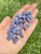 Small polished Tanzanite Tumbled Stones held in hand, soft periwinkle blue color