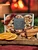 Winter Spice Candle tealight gift box with red ribbon beside cinnamon sticks and dried orange slices by a cozy fireplace