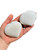Two polished Scolecite hearts in hand, one showing a radiating spray of crystal fibers