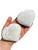 Two white Scolecite hearts in hand, one with gray feathery inclusions and one with silky fibers