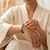 Woman wearing a Third Eye Chakra elastic bracelet on her wrist