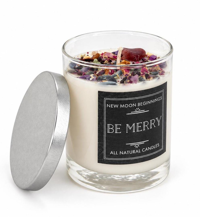 Be Merry holiday crystal candle by New Moon Beginnings in a 7.75 oz glass jar with silver lid, topped with red aventurine and crystals