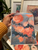 Colorful floral wall art displayed in a contemporary living room