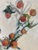 abstract oil painting of oranges in ceramic white vase