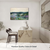 Abstract garden landscape canvas print in blue, green and lavender displayed above a modern living room console