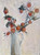 Orange persimmons arranged in a rustic ceramic pitcher, featured in an impressionistic still life canvas print by Kentucky artist Shakia Harris.