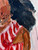 A serene portrait of a Black woman in a red-striped dress, embodying strength, presence, and the peace of living in the moment in “I Can’t Worry About Tomorrow.”