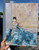 Abstract portrait painting featuring a feminine figure in a flowing blue dress, created with expressive palette knife texture and layered oil paint. This contemporary feminine art blends soft romantic artwork with emotional abstract painting, creating a moody yet airy presence perfect for modern interiors. The textured oil painting combines impressionist portrait painting techniques with blue and neutral artwork tones for a calming, healing inspired atmosphere. Ideal as gallery wall art, organic modern wall decor, or luxury feminine artwork, this 12x16 oil painting complements collected home aesthetic spaces with its soft blue artwork, expressive figure painting style, and modern romantic wall art appeal. Contemporary oil painting by Shakia Harris featuring painterly movement, feminine elegance, and modern portrait artwork designed for sophisticated interiors.