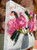 Funny How Time Flies original 10x10 oil painting by Shakia Harris featuring vibrant pink and magenta peonies in a textured gray vase.
