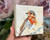 **Your Awakening** is a 4x4 original textured oil painting featuring a vibrant orange bird emerging through expressive layers of warm earth tones, ivory, blue-gray, and brown. Rich impasto and palette-knife texture give this small original artwork remarkable depth and dimension, while the impressionistic brushwork captures the bird in a moment of movement and transformation. This contemporary bird painting is a unique piece of original oil artwork for collectors drawn to textured paintings, nature-inspired art, small original canvases, and expressive impressionistic artwork.