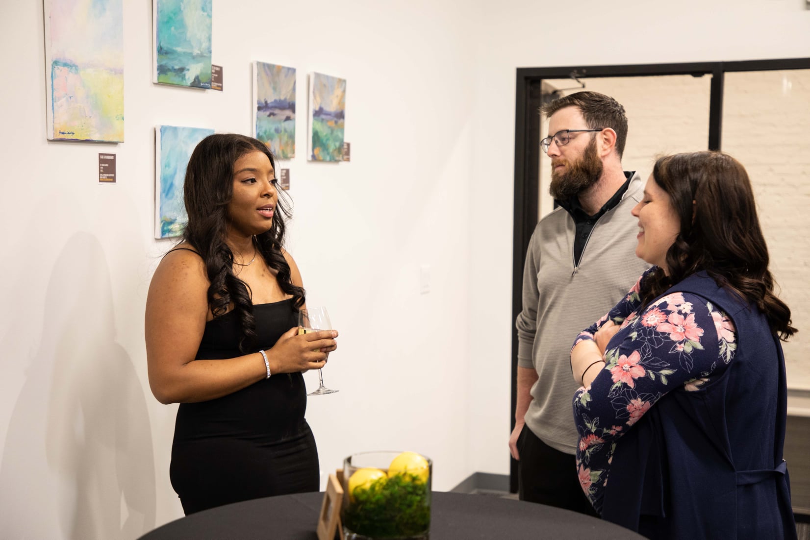 emerging louisville ky oil painter shakia harris solo exhibition debuted in the illustrious NULU, Downtown Louisville area. Her exhibit featured 22 original oil paintings influenced by her journey with surviving gun violence and creating a new life.