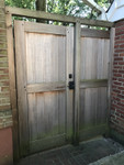 Bronze double cylinder deadbolt on cedar gate Bronze double cylinder deadbolt on cedar gate