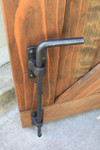 Coastal Bronze 80-100 Cane Bolt holding open a double gate