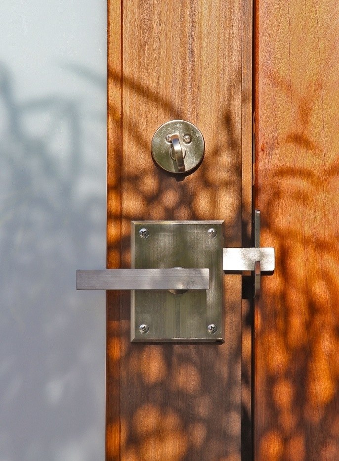 Contemporary alta stainless steel gate latch on wood gate built by lido gates