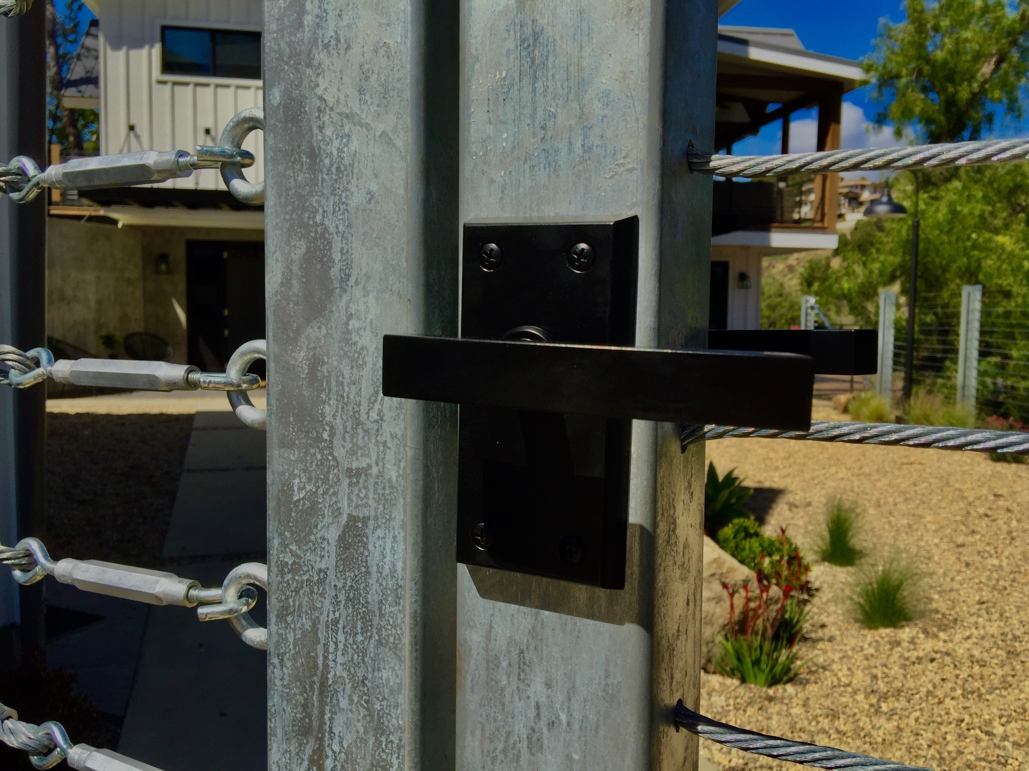 nero-contemporary-gate-latch-on-stainless-gate-at-contemporary-farmhouse.jpg