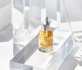 Oligoperformance Serum on a glass table