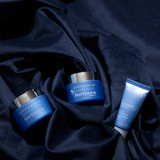 Oligopur Youth Cream 50 ml Jar, Expert Youth Cream 50 ml jar and Sublime Night Skin Renewing Soothing Balm Travel Size 15 ml tube laying together on the ground.
