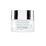 White Phytomer Cyfolia Youth cream jar with silver lid showing teal product labeling and organic certification logos.