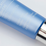 Angled view of blue Phytomer Skin Lumination tube showing French product text including "Crème Teint," "Taches - Rides," "Complexion Cream," and "Dark Spots - Wrinkles."