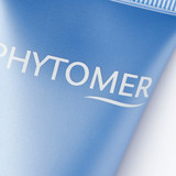 Detail shot of the "PHYTOMER" brand name printed in white letters on blue product packaging.