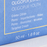Product packaging label showing "Oligopur Youth" cream details for pores, imperfections, blemishes and wrinkles in 50ml size.