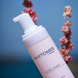 Pink Rose Visage Cleansing Foam with pink flowers behind it.