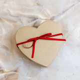 Valentines Mystery Box - a heart shaped box with a bow tied around it.