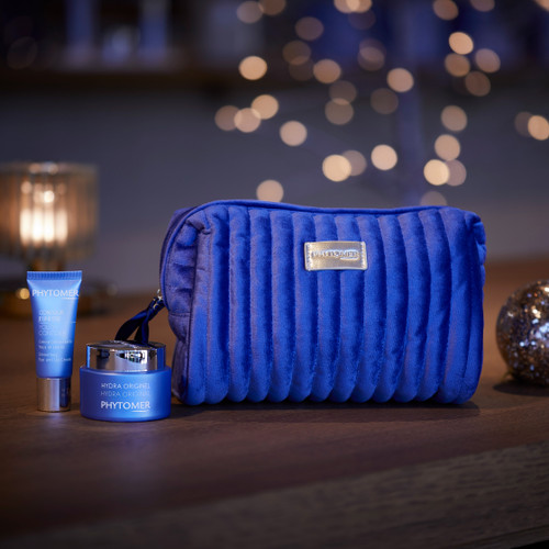 The Hydra Original Cream sits next to the youth contour eye cream and a blue velvety pouch.