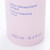 A detailed view of product text on a pink bottle reading "Lotion Démaquillante Tonique / Toning Cleansing Lotion" with "250 ml - 8.4 fl oz" visible at the bottom. A detailed view of product text on a pink bottle reading "Lotion Démaquillante Tonique / Toning Cleansing Lotion" with "250 ml - 8.4 fl oz" visible at the bottom.