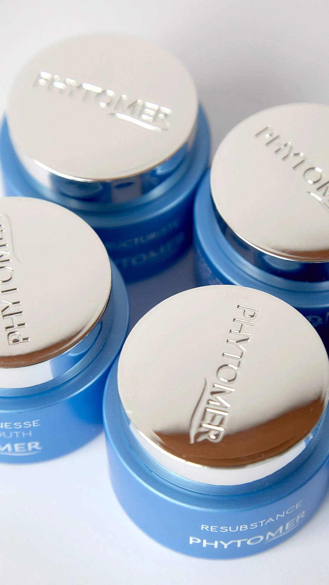 Four phytomer face creams on a table