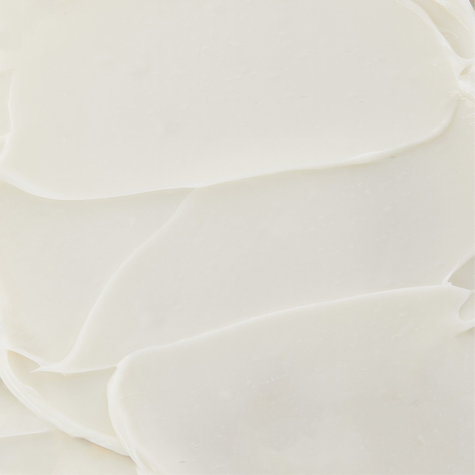White Perles Des Mers cream texture with smooth swirls on beige background