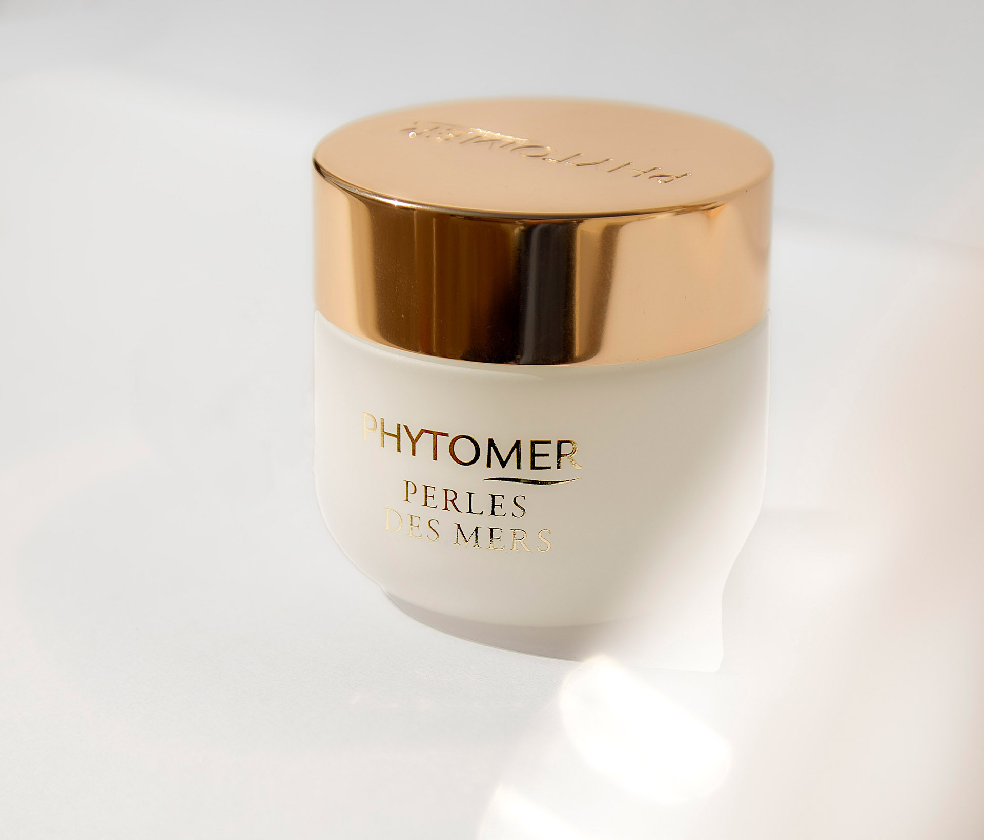Phytomer Perles des Mers cream jar with gold lid on white background