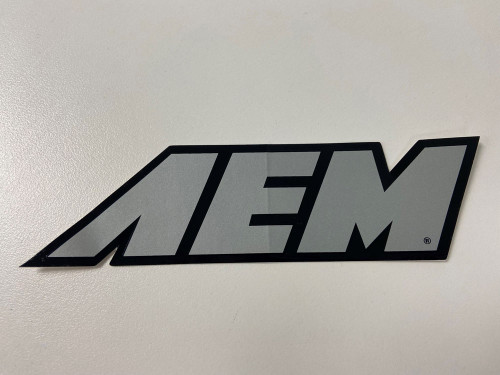 DECAL; AEM, METALLIC SILVER, 5-1/2" X 1-1/2" PN:10-956