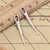 Embroidery needle charm - antique silver