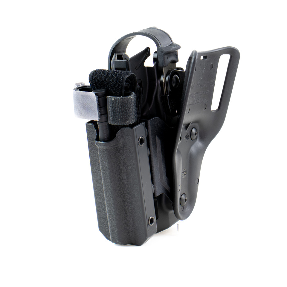 Pistol holster mount for tourniquet carrier.  Tourniquet mounting bracket for Safariland SLS / ALS holsters.  Red dot and non-red dot sight models.   Red dot and non-red dot sight models. Eleven 10 RIGID TQ Case Holster Mount.