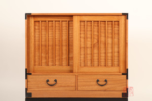 Handcrafted Kiri wood Ko Tansu with two drawers and a single sliding door compartment, reflecting traditional Japanese woodworking and minimalist design.
