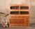 Antique Japanese 2-section Mizuya Tansu kitchen chest from the Taisho period, made of Hinoki and Suginoki wood with sliding glass doors and multiple drawers.