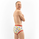 Male model wearing Dinosaur training pants, side-view.