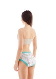Female model wearing adult Alpaca training pants, side-view.